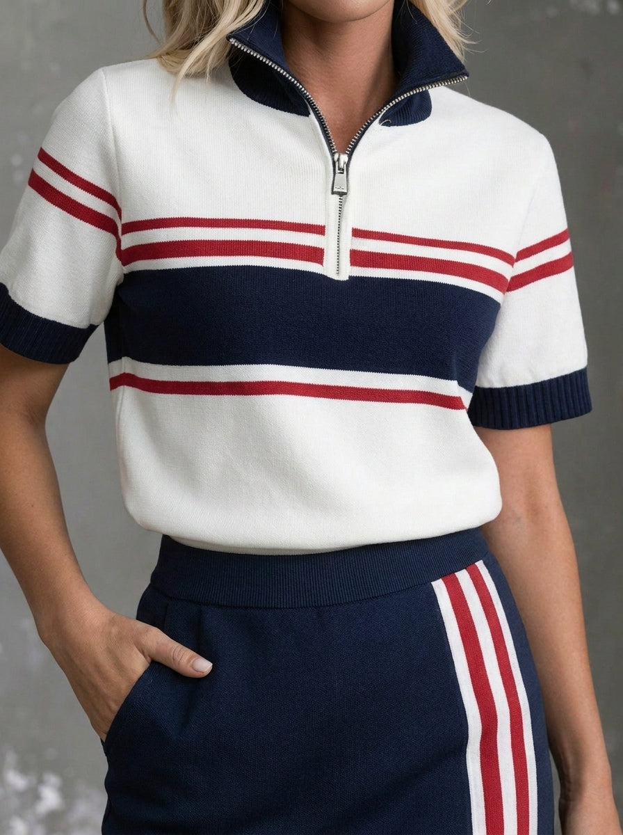 Completo sportivo da donna composto da top a maniche corte a righe con mezza cerniera e gonna con tasche
