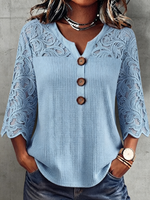 Top elegante in maglia con pannelli in pizzo floreale