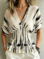 Damenbluse mit abstraktem Pinselstrichmuster, V-Ausschnitt, geraffter Taille, Fledermausärmeln und Peplum-Saum