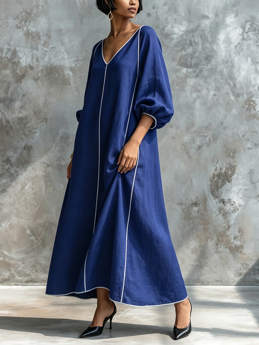 Vestido minimalista y elegante de algodón y lino con mangas farol y detalle de ribete