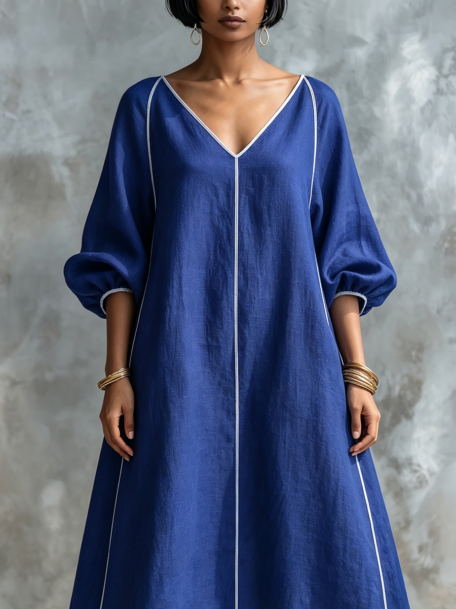 Vestido minimalista y elegante de algodón y lino con mangas farol y detalle de ribete