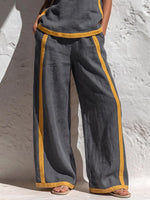 Completo donna in cotone e lino composto da top casual senza maniche con scollo rotondo e pantaloni larghi a vita alta, comodi e ampi.