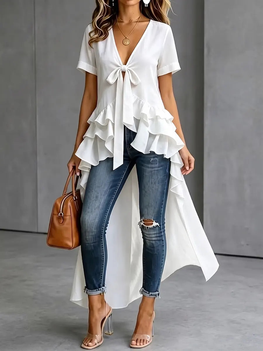 Blouse élégante à volants avec nœud devant et ourlet asymétrique