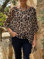 Blusa trasparente da donna con stampa leopardata