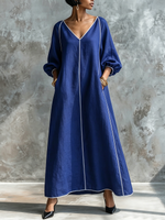 Vestido minimalista y elegante de algodón y lino con mangas farol y detalle de ribete