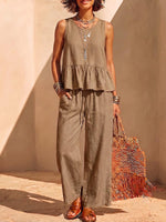 Conjunto para mujer de algodón y lino de color sólido: blusa sin mangas con cuello redondo y ajuste holgado, y pantalones de pierna ancha de talle alto.