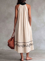 Vestito casual da donna in lino, senza maniche, ampio, con stampa posizionata e colletto morbido.