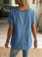 Top casual in denim di cotone con rifinitura a taglio