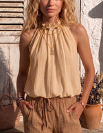 Top donna alla moda e versatile con perline e collo halter a bolle