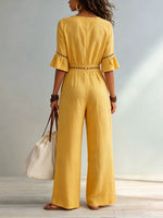 Dames jumpsuit van katoen-linnen met eyelet uitsnijding, V-hals, ruches aan de mouwen en wijde pijpen