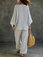 Completo donna a due pezzi in cotone e lino con maglia a maniche lunghe a righe e pantaloni casual artisticamente stilizzati