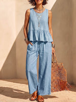 Conjunto para mujer de algodón y lino de color sólido: blusa sin mangas con cuello redondo y ajuste holgado, y pantalones de pierna ancha de talle alto.