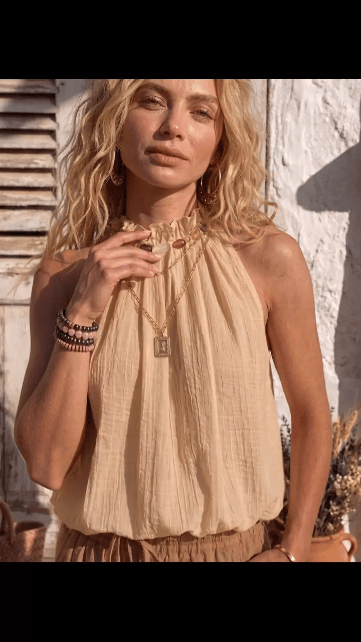 Top donna alla moda e versatile con perline e collo halter a bolle