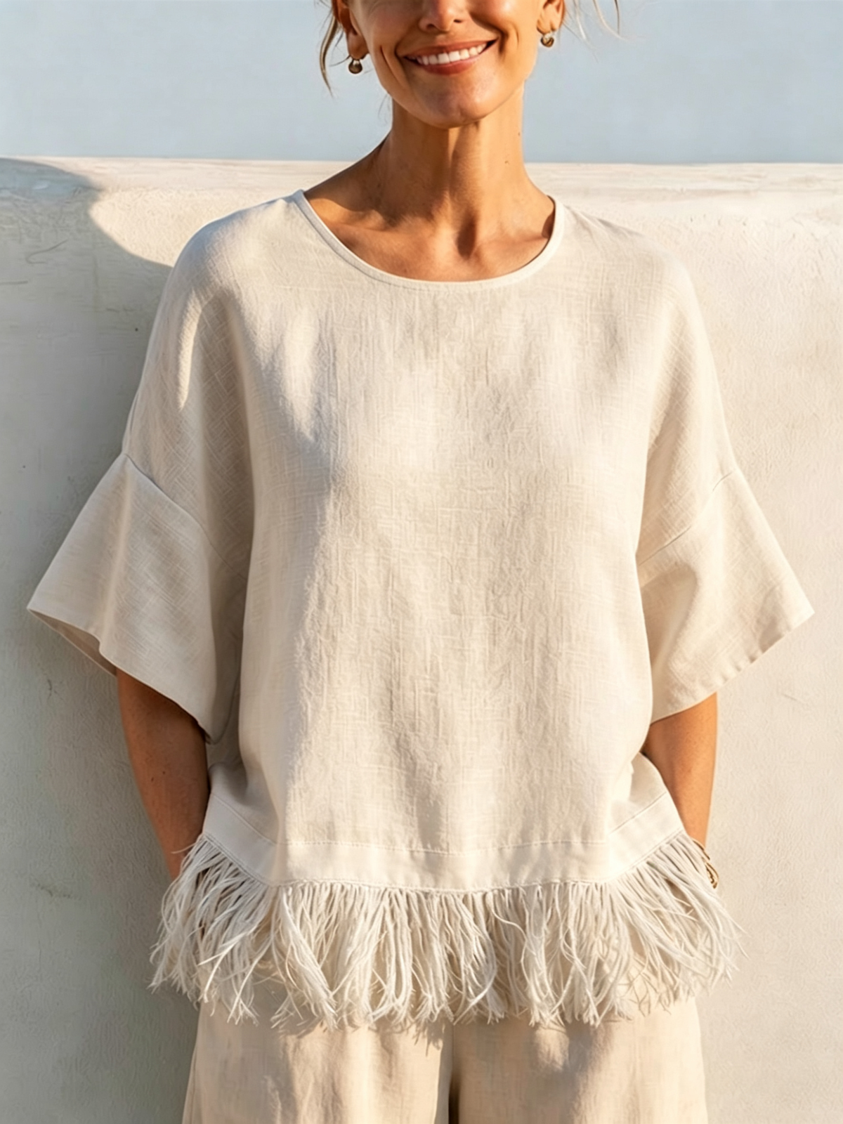 Solid-color Washed Linen Loose-fit Top Featuring A Round Neck, Ruffled Mid-length Sleeves, And A Tassel Hem—designed For A Relaxed, Flattering Fit