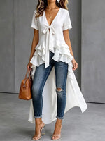 Elegante blouse met strik aan de voorkant en ruches, met een hoge-lage zoom