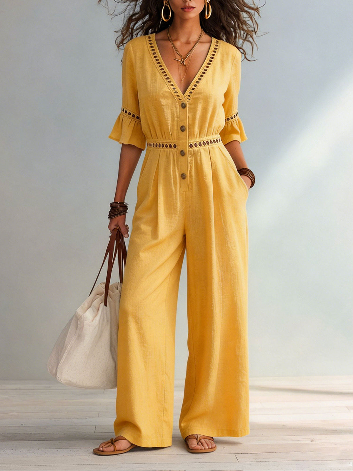 Dames jumpsuit van katoen-linnen met eyelet uitsnijding, V-hals, ruches aan de mouwen en wijde pijpen