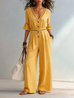 Dames jumpsuit van katoen-linnen met eyelet uitsnijding, V-hals, ruches aan de mouwen en wijde pijpen