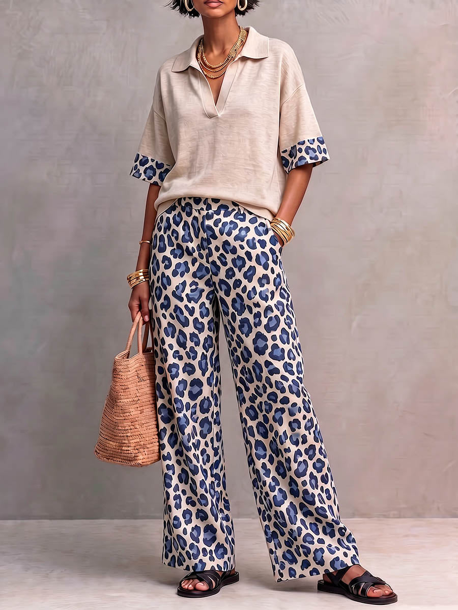 Dames tweedelig set met een casual, losvallend, kort mouwig pullover topje met kraag en een hoge taille, losvallende, wijde broek met luipaardprint.