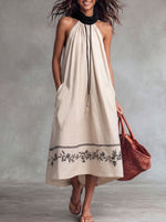 Vestito casual da donna in lino, senza maniche, ampio, con stampa posizionata e colletto morbido.