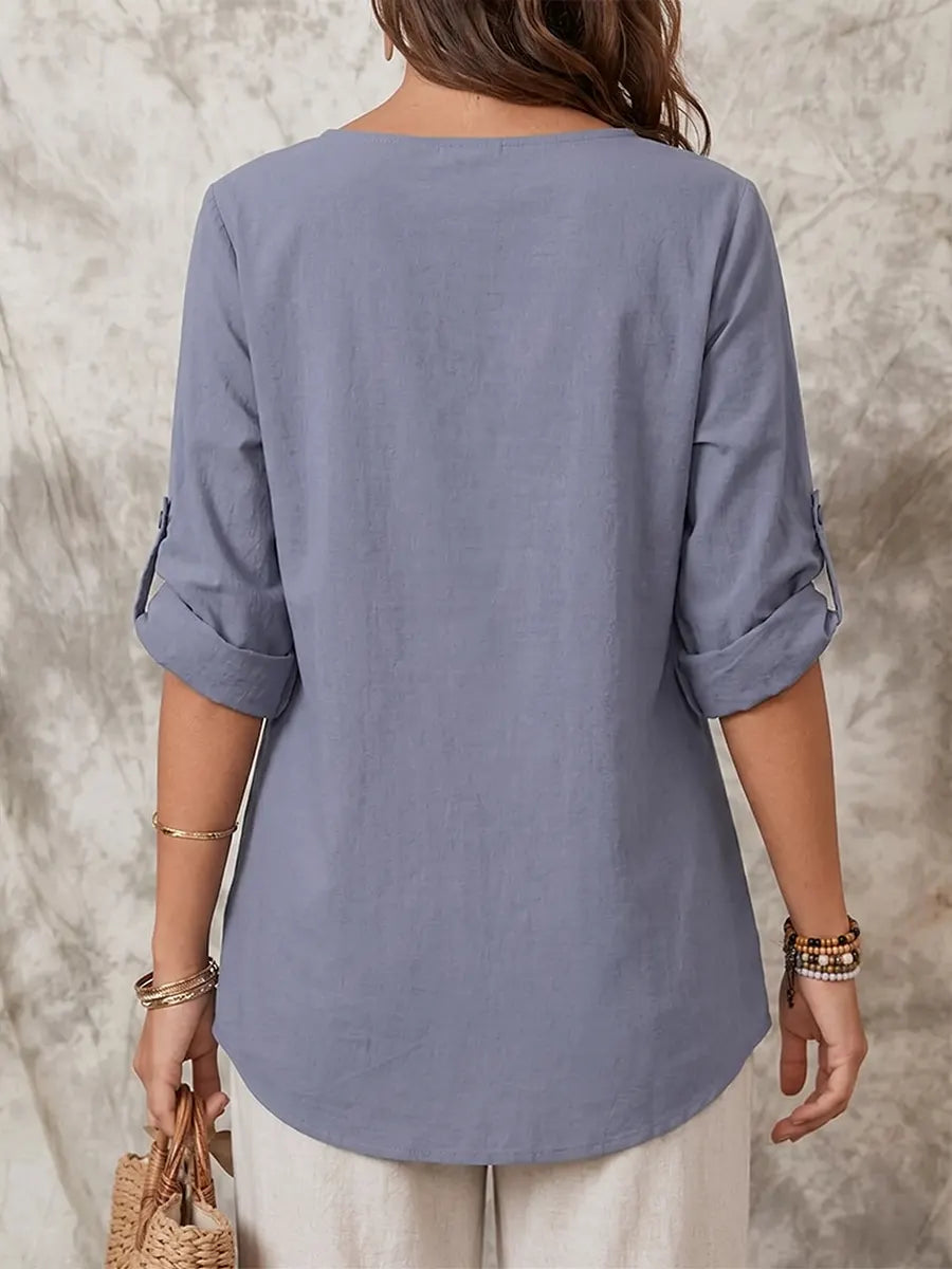 Elegante asymmetrische Tunika mit Rüschen und Oberteil mit hochgekrempelten Ärmeln
