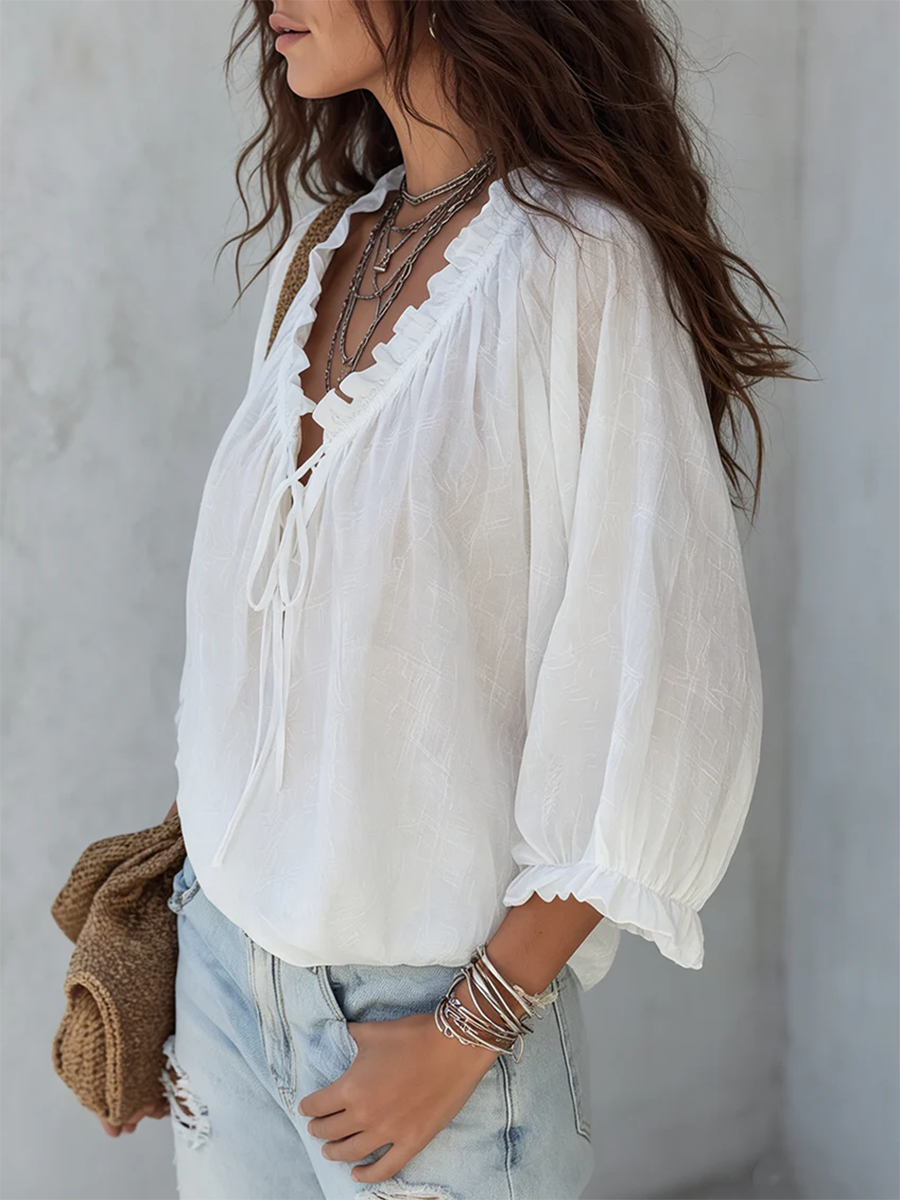 Blouse rétro à volants avec col en V et nouée devant